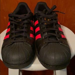 Black and red adidas shell toes